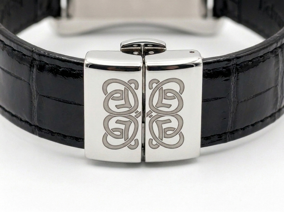 Belvaur Guichet Noir — butterfly clasp with split-cipher engraving